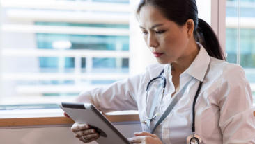 Image of woman reading a tablet